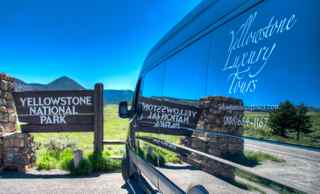 Yellowstone Luxury Tours' Mercedes Sprinter Van at the Gateway to Yellowstone National Park